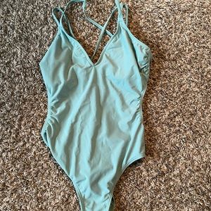 Green One piece w/ cut out on sides
